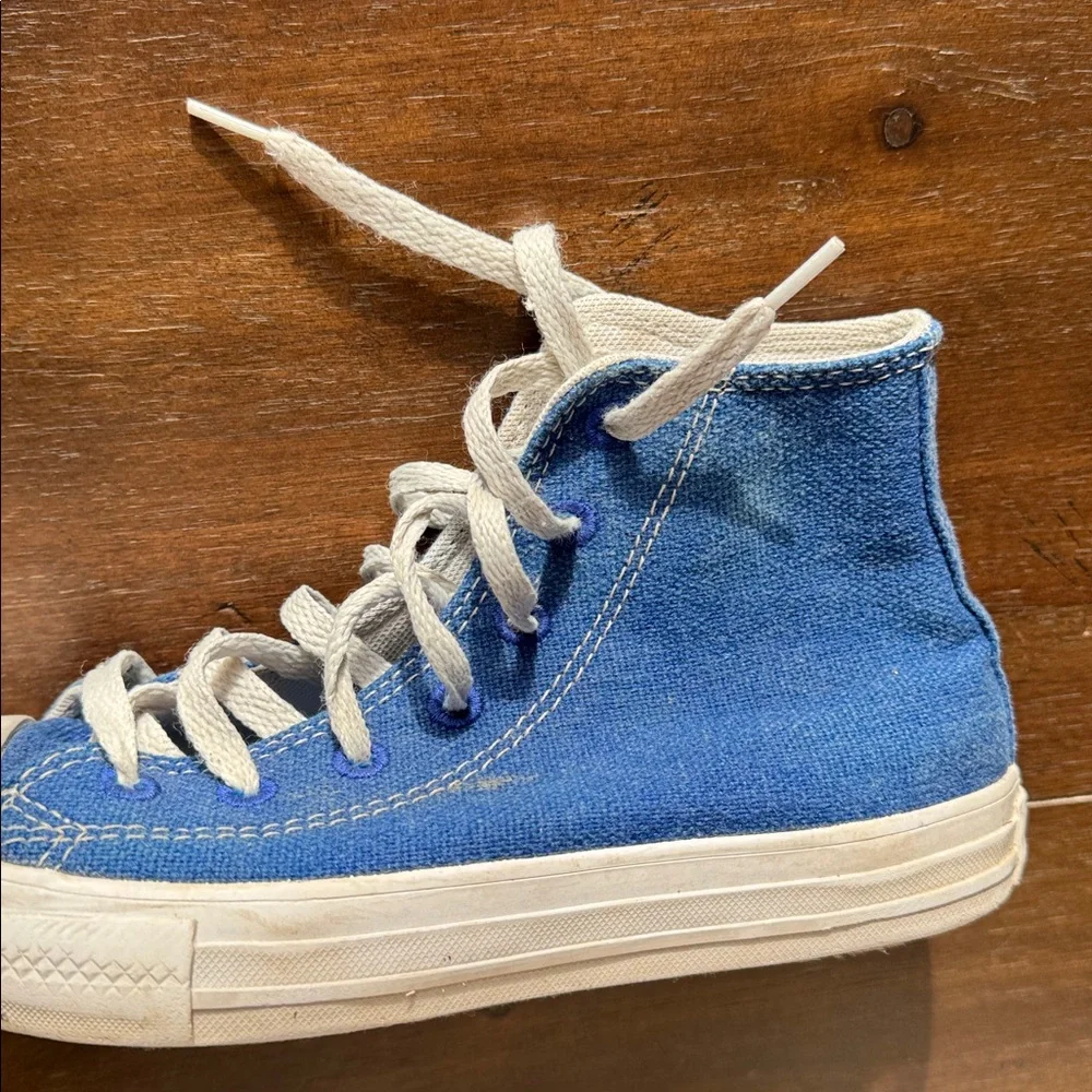Size 2 Converse Chuck Taylor All Star Sneakers on blue